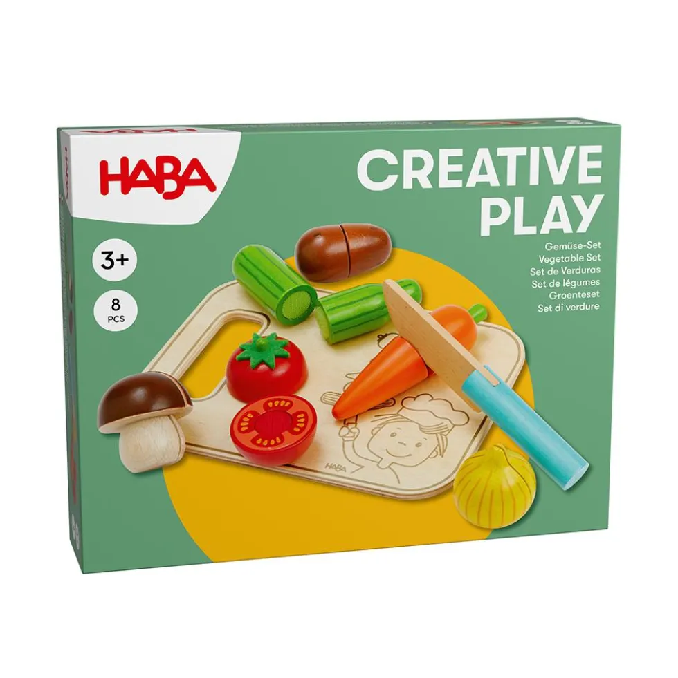 Set de verduras con tabla de cortar y cuchillo